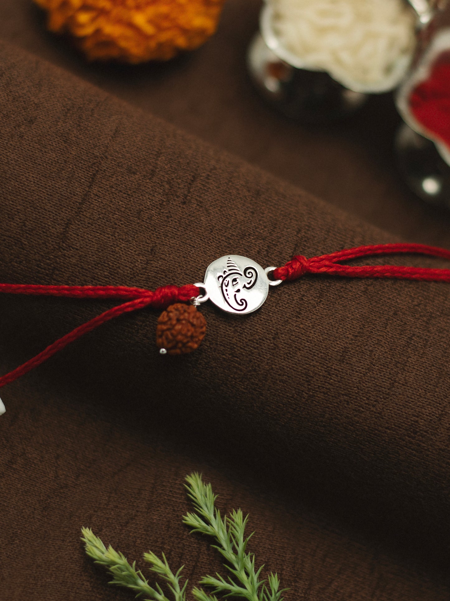 Meenakari Small Ganesha Coin with Rudraksha Sterling Silver Rakhi set with Roli Chawal and greeting card