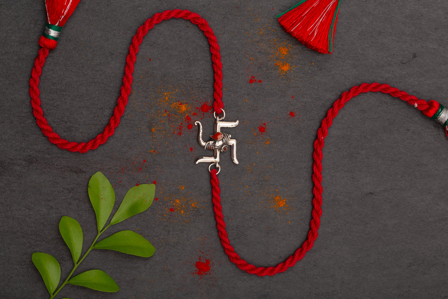 Meenakari Swastik Ganesh Sterling Silver Rakhi set with Roli Chawal and Greeting Card
