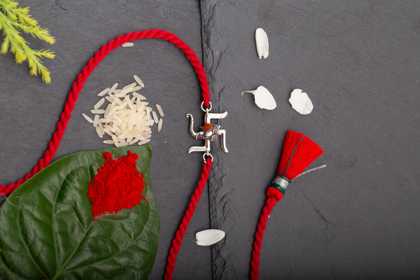 Meenakari Swastik Ganesh Sterling Silver Rakhi set with Roli Chawal and Greeting Card